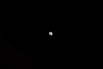 Low angle view of moon against sky at night