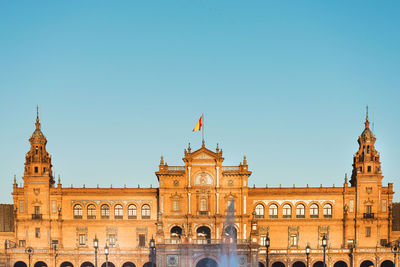 View of historic building against clear blue sky