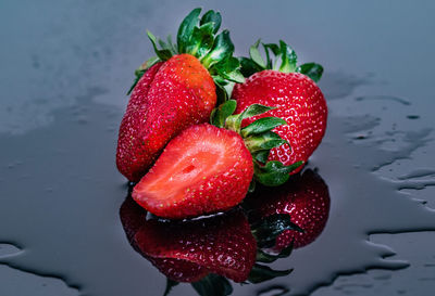 High angle view of wet strawberries