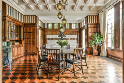 Empty chairs and tables in building