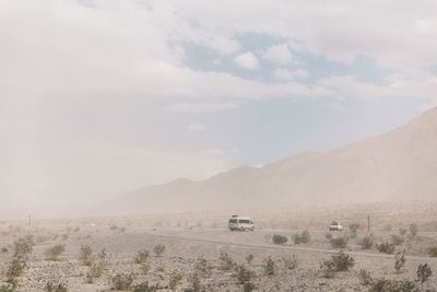 Scenic view of death valley against sky during sandstorm