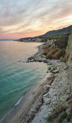 Scenic view of beach against sky during sunset