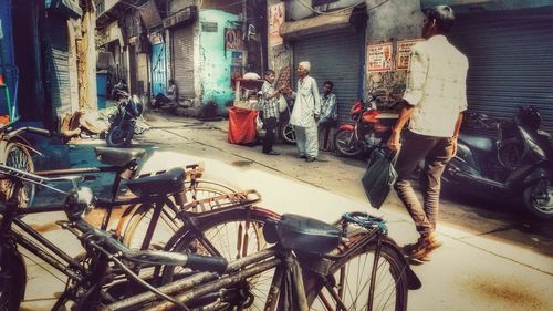 Man standing on street in city