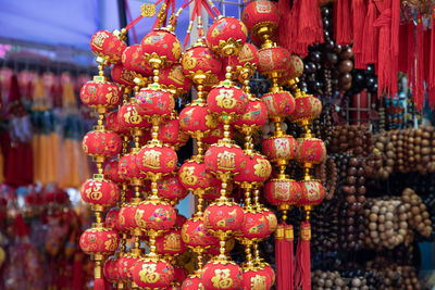 Red lanterns hanging for sale in market
