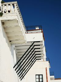 Low angle view of building against clear blue sky
