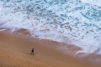 Aerial view of boy on beach