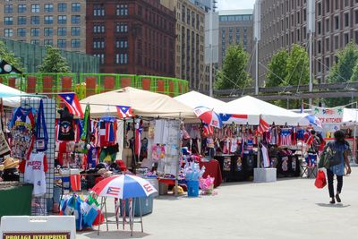 People at market stall in city