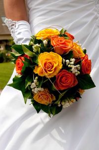 Close-up of woman holding bouquet