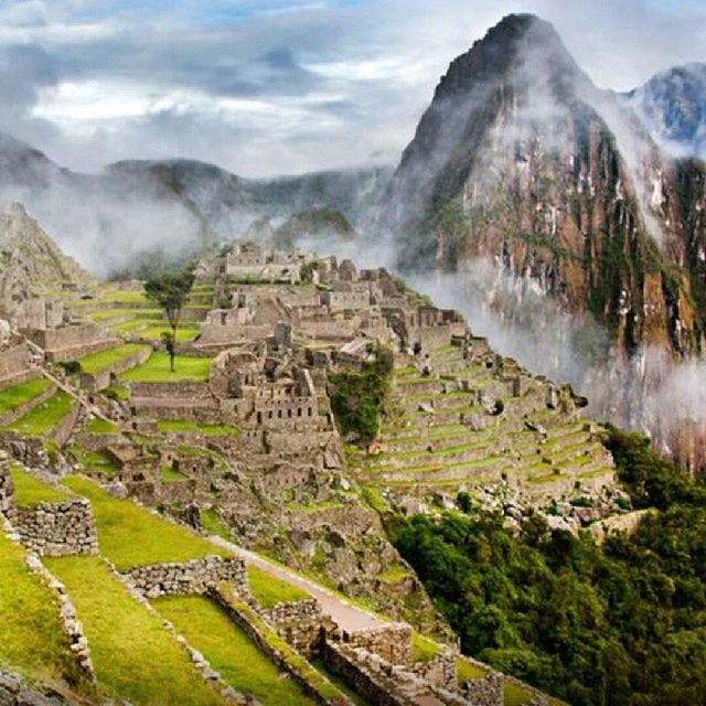 architecture, built structure, mountain, building exterior, history, sky, landscape, ancient, old ruin, the past, famous place, travel destinations, mountain range, tourism, high angle view, scenics, ancient civilization, international landmark, travel, cloud - sky