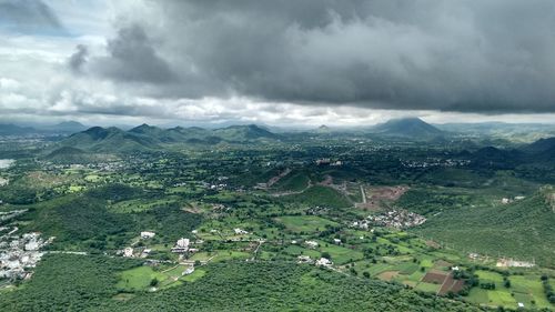 High angle view of cityscape against cloudy sky