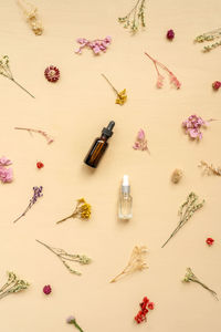 High angle view of pink bottles on table