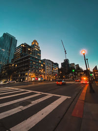 City street and buildings against sky