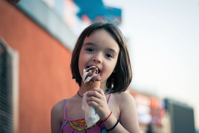 Little girl eating ice cream outdoors