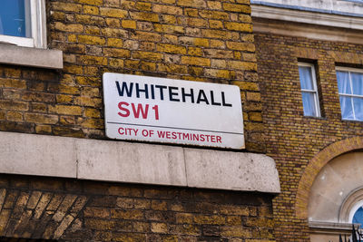 Close-up of text on brick wall