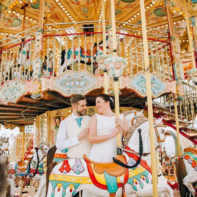 indoors, lifestyles, amusement park, leisure activity, amusement park ride, art, creativity, art and craft, arts culture and entertainment, carousel, childhood, fun, tradition, casual clothing, human representation, religion, enjoyment, low angle view