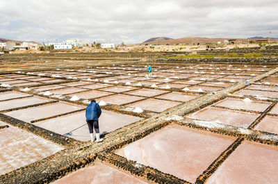 Workers working at salt flat