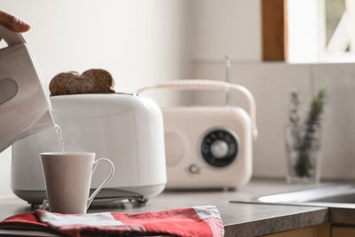 Close-up of coffee cup on table at home