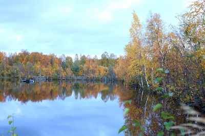 Scenic view of lake against sky during autumn