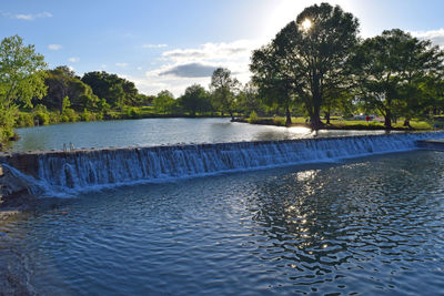 River in park against sky