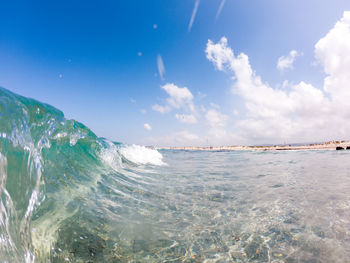 Scenic view of sea against blue sky