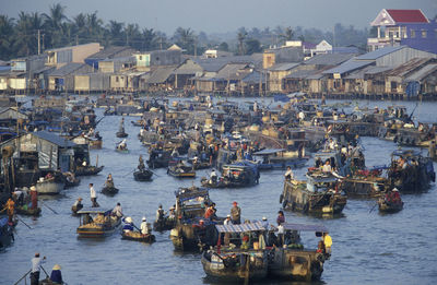 People in boats at harbor