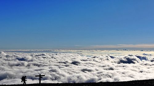 Scenic view of vapor trail against clear blue sky