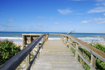 Pier over sea against sky