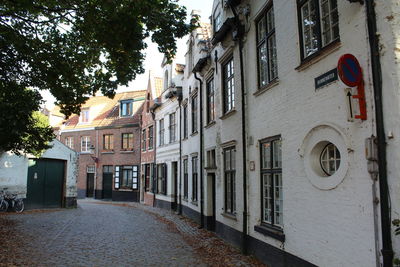 Street amidst buildings against sky