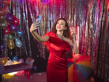 Portrait of woman with balloons