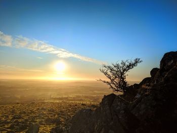 Scenic view of landscape against sky during sunset