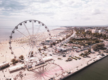 High angle view of ferris wheel in city