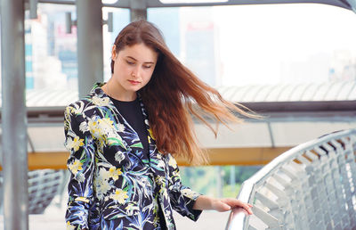 Beautiful woman with long hair standing