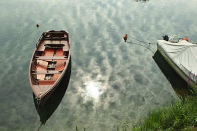 High angle view of boat moored in lake