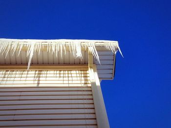 Low angle view of built structure against clear blue sky