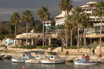 Boats moored in sea against sky