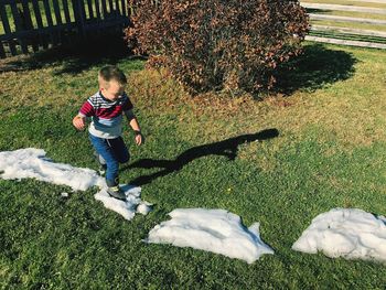 Full length of boy on field