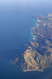 Aerial view of sea and island against sky