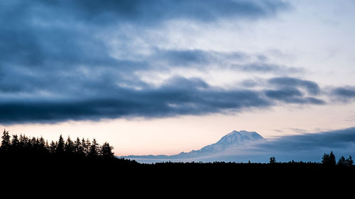 Scenic view of silhouette mountains against sky during sunset