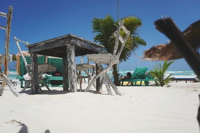 Lifeguard hut on beach against clear sky