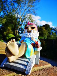 Statue against clear blue sky in park