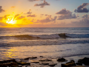 Scenic view of sea against sky during sunset