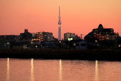 View of illuminated city at sunset