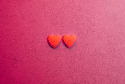 Close-up of heart shape on pink background