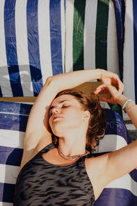 High angle view of woman relaxing on beach