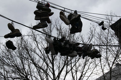 Low angle view of swing ride against sky