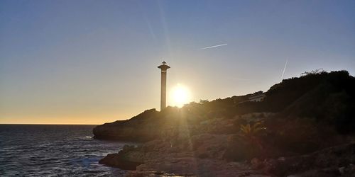 Scenic view of sea against clear sky during sunset