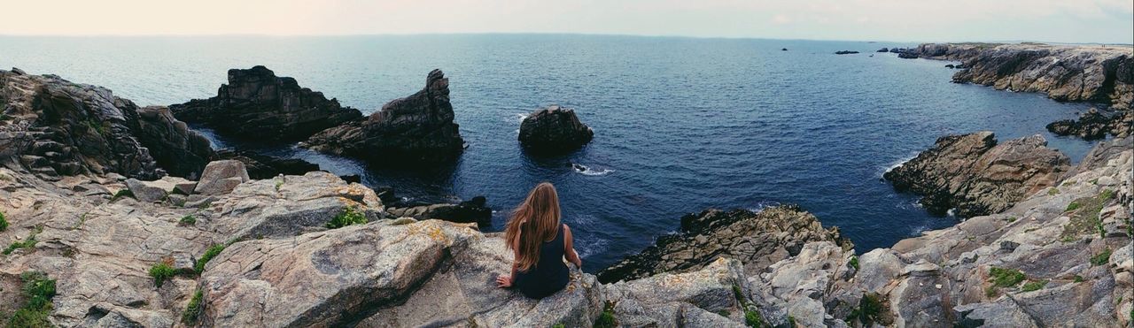 rock - object, rock formation, water, tranquility, tranquil scene, scenics, rock, sea, beauty in nature, cliff, mountain, nature, high angle view, leisure activity, sky, geology, lifestyles, idyllic, physical geography