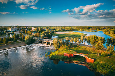 High angle view of river in city against sky