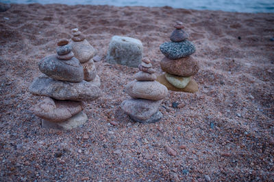 Close-up of rock on sand at beach