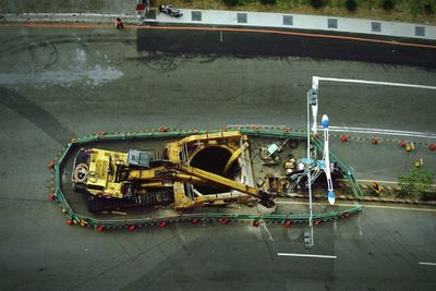 High angle view of earth mover at road construction site